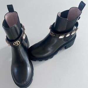 Gucci Black Ankle Boots with Gold Embellishments.